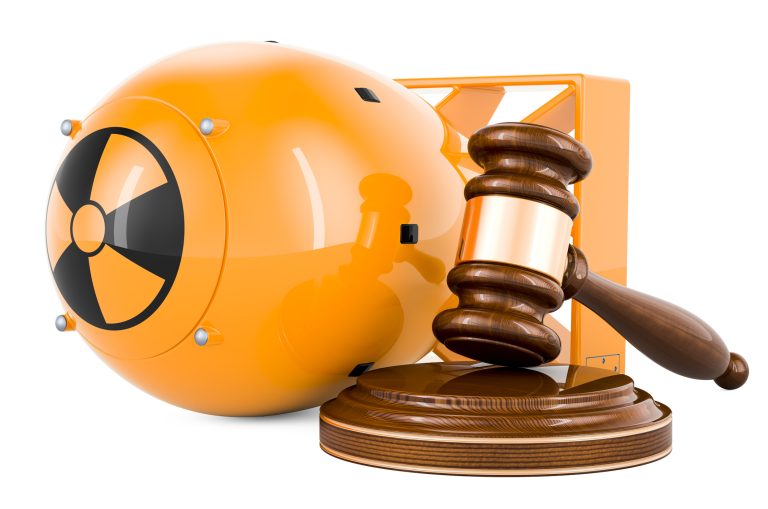 Atomic bomb with wooden gavel, 3D rendering