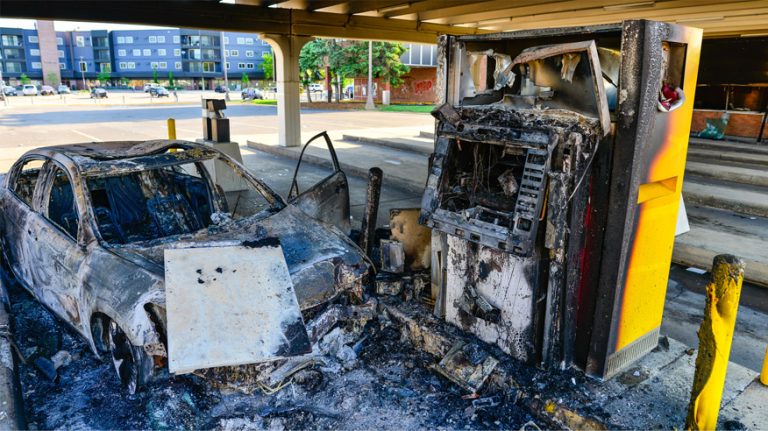 Car and ATM burnt in the City of Minneapolis after rioting and unrest